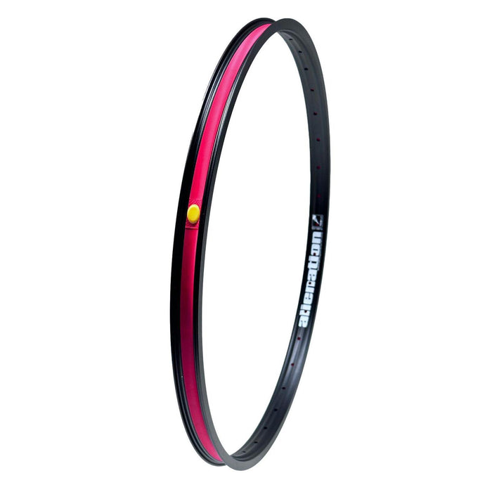 The Alienation Malice G69 TCS 24 Inch Braked Rim features a sleek black and red design highlighted with small yellow and red accents. It boasts an advanced 4D drilling construction, complete with the iconic "alienation" logo for added flair.