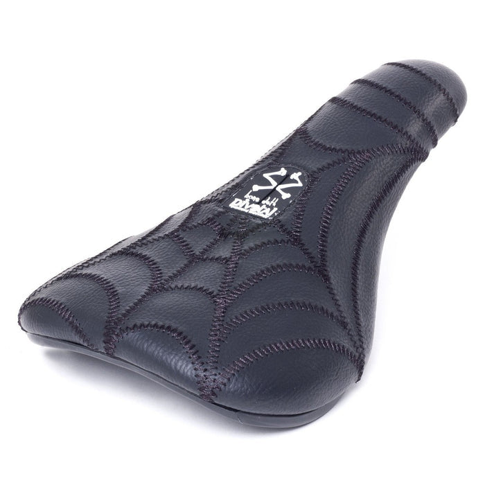 The Bone Deth Spider Pivotal Seat / Slim features a stitched spiderweb pattern, slim padded pivotal design, and a white logo printed near the back.