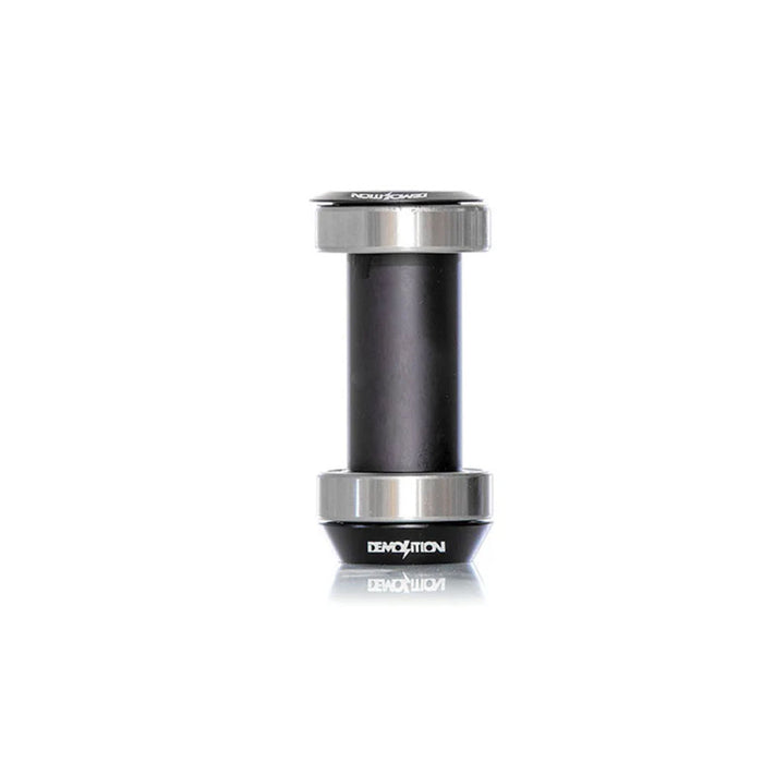 A black and silver Demolition MID Bottom Bracket with sealed bearings and the "Demolition" logo on one end, displayed against a white background.