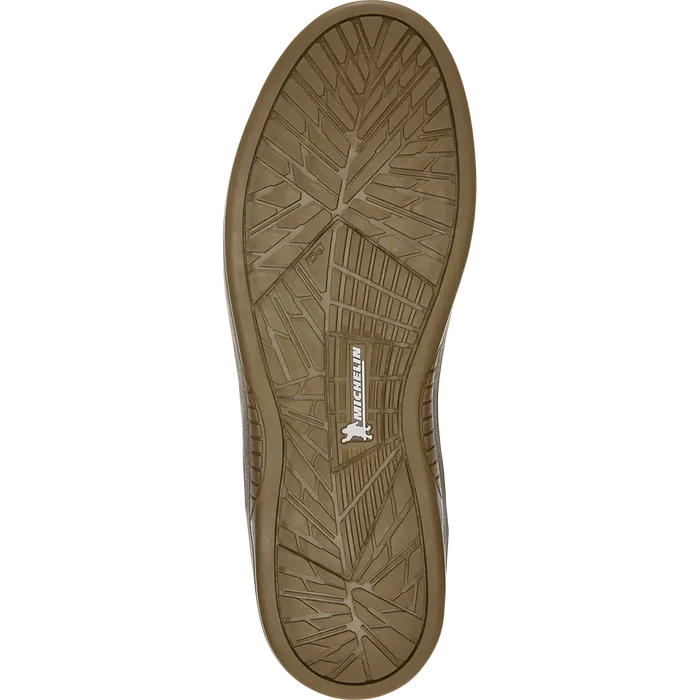 Close-up of the Etnies Marana Michelin Shoe sole in Brown/Black/Gum, displaying a geometric tread pattern and the word "Michelin" in white. Specifically designed for skateboarders, this sole utilizes Michelin performance rubber to offer exceptional durability and grip.
