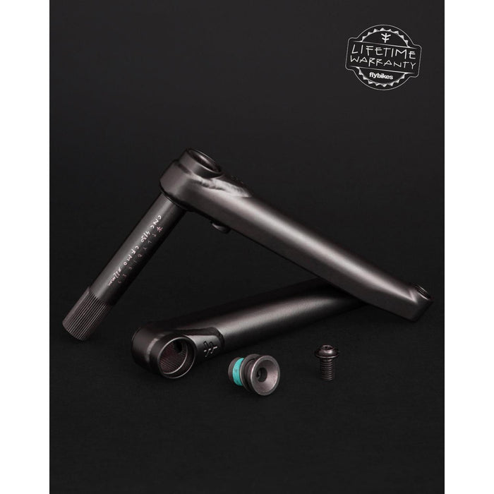 Bicycle crankset parts on a black background, featuring two black Fly Bikes Dolmen 24 Cranks made of 4130 Chromoly, accompanied by a bolt and nut. A "Lifetime Warranty" label is prominently displayed in the top right corner.