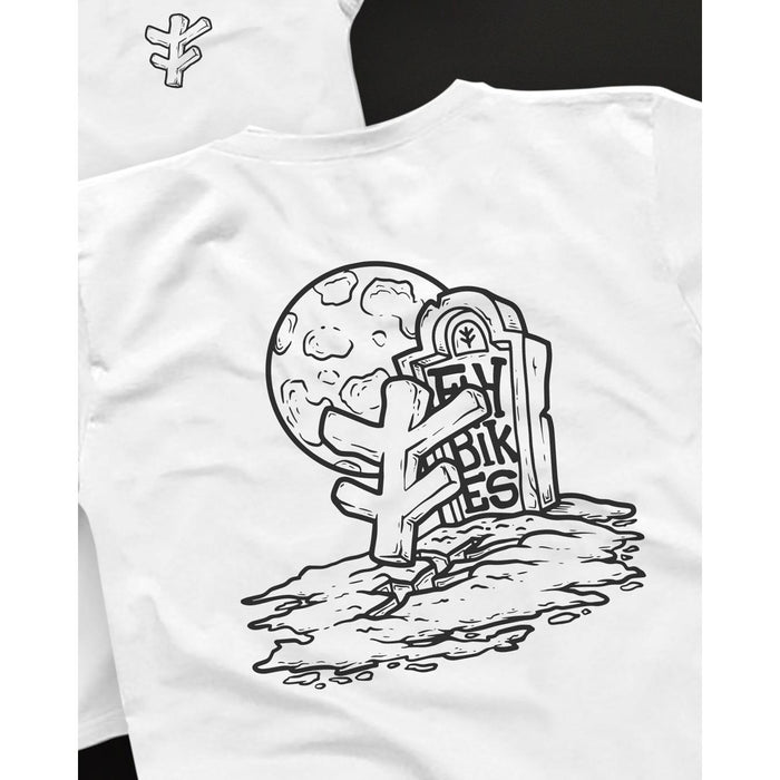 The Fly Bikes Grave T-Shirt showcases an illustration of a "New Vibes" tombstone, with a tree and full moon backdrop, crafted from organic cotton for sustainable apparel excellence.
