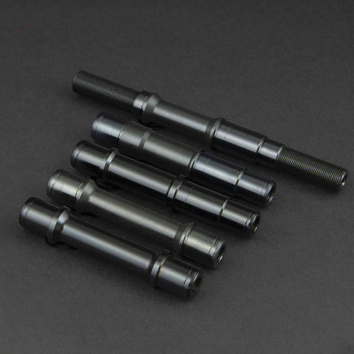 Four replacement Fly Bikes Magneto Female Front Axles on a black surface.