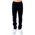 Person wearing FP Pants Relaxed Fit Chino Black and white sneakers, cropped at the torso.