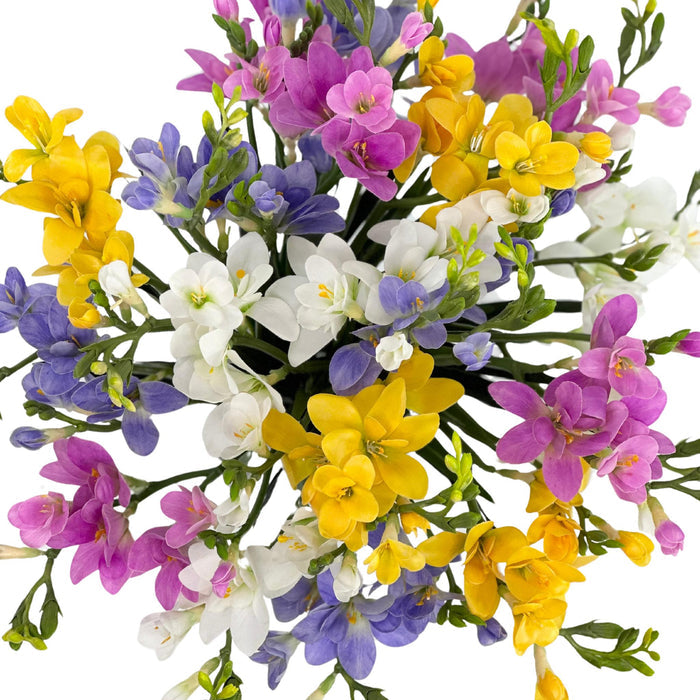 Freezia Mix Silk Flower Arrangement in Glass Vase. Top Close up view. Arrangements available from www.plantcouture.co.za