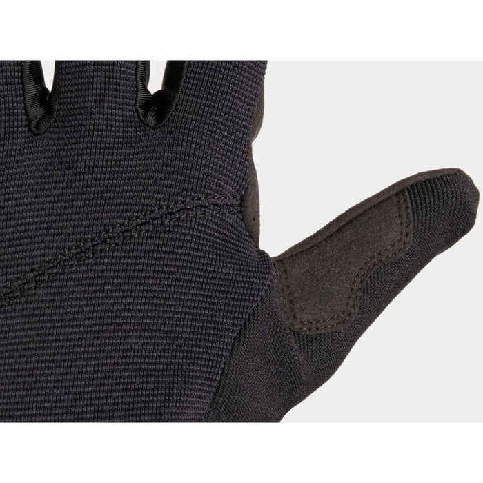 Close-up of a Fuse Alpha Youth Glove, showcasing intricate stitching and textured synthetic leather on the reinforced thumb area.