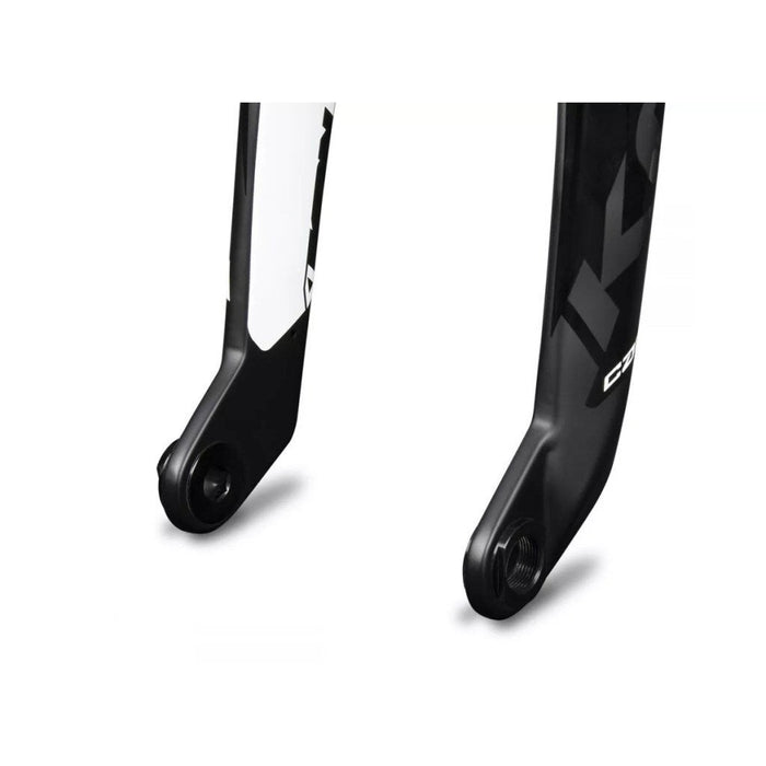 Two Ikon 20-10mm Fork Adapters bicycle forks side by side, one primarily white with black details and the other primarily black with white details.