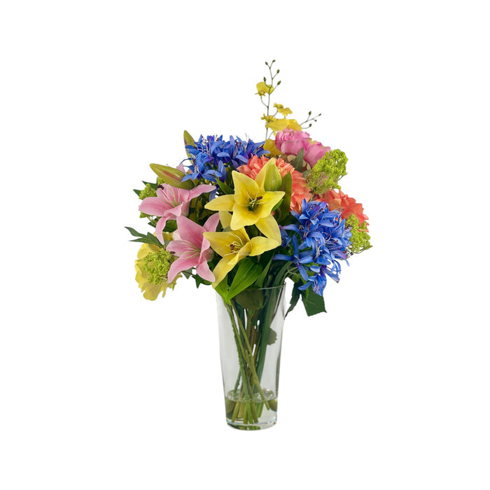 Mixed Agapanthus Peony and Lily Arrangement in a Glass Vase