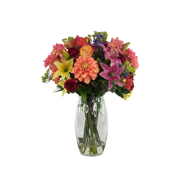Mixed Dahlia Amaryllis and Rose Arrangement in a Glass Vase