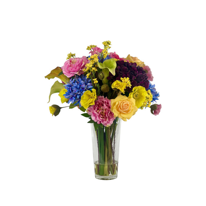 Mixed Hydrangea Poppy and Arum Lily Arrangement in a Glass Vase