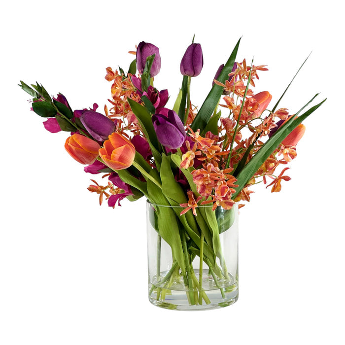 Bouquet of flowers in a clear glass vase on a white background