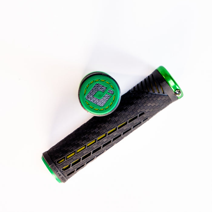 ODI CF Lock On Grips V2.1 Izaac Kennedy Signature in black and green with a textured surface, displayed against a white background. This Australian exclusive handlebar grip is designed for champions.