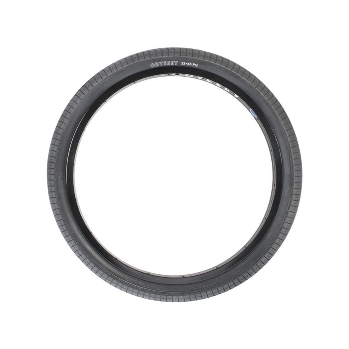 A black bicycle tire with a treaded pattern, designed using a proprietary rubber compound for superior grip. The branding "Odyssey Path Pro 24 Inch Tyre" is visible on the side.