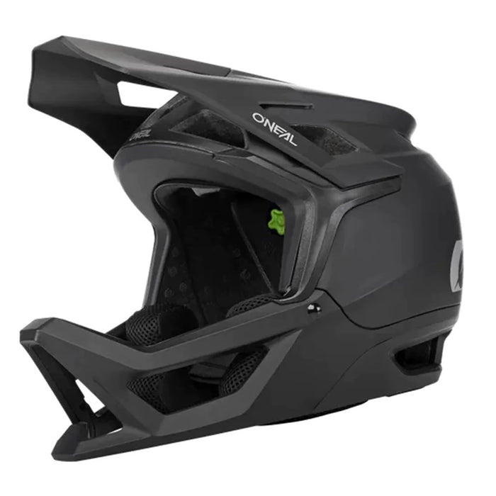 The Oneal Transition Helmet is a black, lightweight full-face helmet featuring a visor, chin guard, and ventilation openings for maximum airflow.