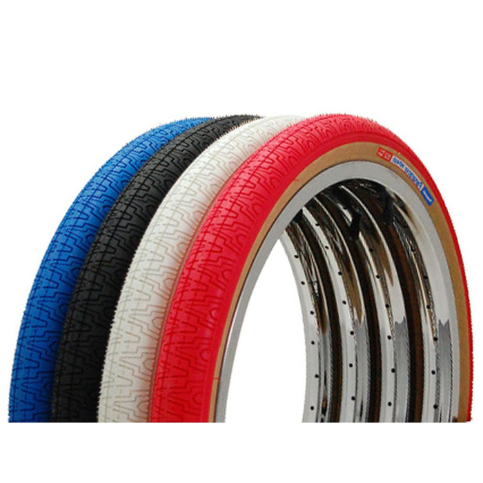 Four Panaracer HP-406 20 Inch Tyres in blue, black, white, and red are displayed side by side against a white background. These Retro BMX tyres feature a high-pressure casing for enhanced performance and durability.