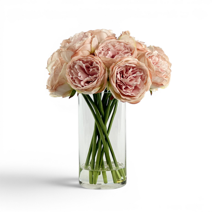 Light Pink faux Peony stems in a glass vase with artificial water