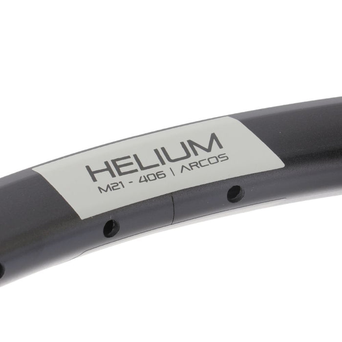 Close-up of a black PRIDE Helium Brakeless Expert Rim, designed for junior BMX race bikes, featuring visible spoke holes and detailed labeling.