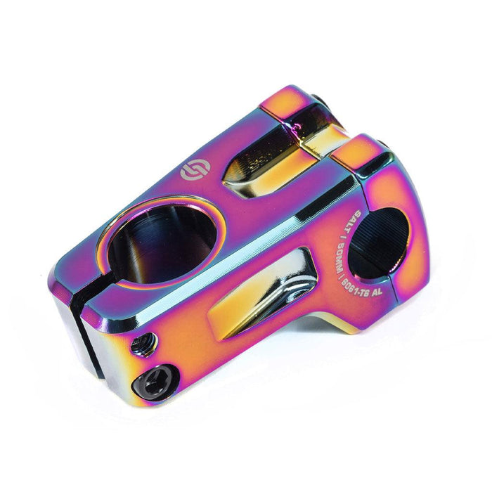 The Salt Pro V2 Front Load Stem (22.2mm Clamp) is a rainbow-colored BMX bike stem made from durable 6061-T6 alloy, designed with multiple bolts and engraved details to securely attach handlebars to the fork.