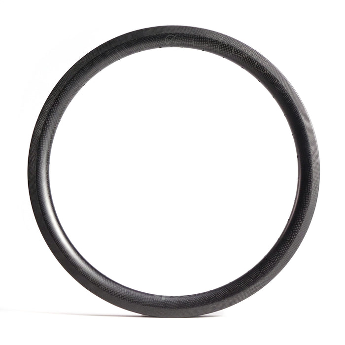 On a plain white background, the Spectre V2 Carbon Fiber 20 Inch Brake Rim, with its striking black round tire and lightweight 36-hole design, is elegantly displayed.