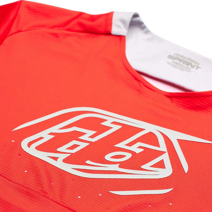A red TLD Sprint Jersey Icon Race Red BMX race jersey with a logo on it.