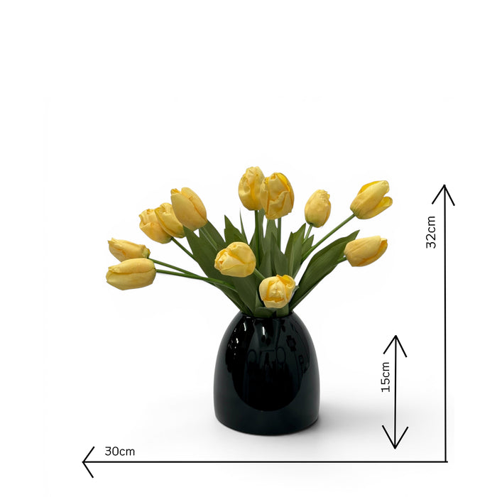 Black vase with yellow faux tulips and dimensions indicated on a white background