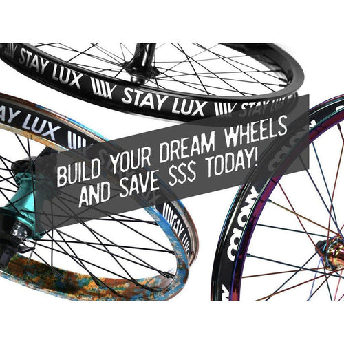 Three vibrant bicycle wheels with “STAY LUX” text and a banner overlay reading “BUILD YOUR DREAM WHEELS AND SAVE $$$ TODAY!” in bold white letters, showcasing the (Workshop) Spectre High Strength Wheel Build (36 Hole) with stainless steel spokes—enjoy 50% OFF LABOUR when you purchase a rim and hub.
